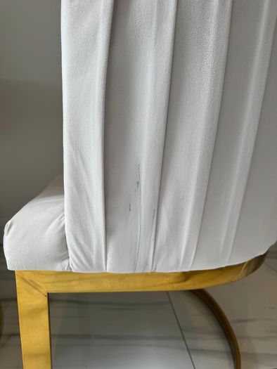 Cream and gold armchairs