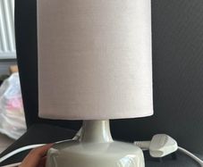 Dunned beside lamp