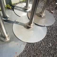 Stainless steel barrier posts for queue management with heavy duty bases for stability. The tops have fitting for ropes or belts to be attached between them.