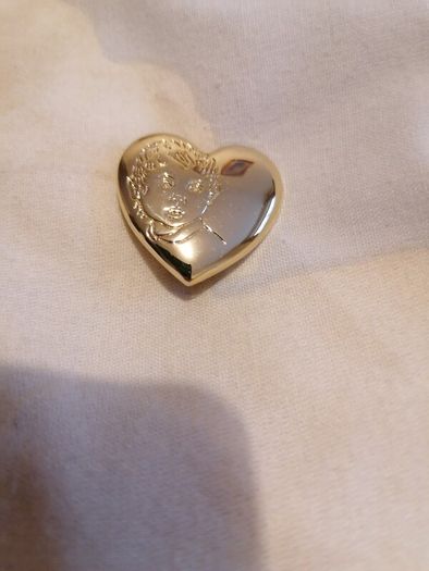 the variety club child's face brooch.