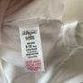 2 dunnes white polo shirts (as new) age 9-10 Image 5