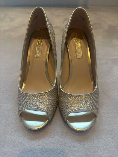 Gold glitter peep-toe heels.