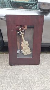 Handcrafted encased iron violin (case slightly damaged)