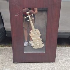 Handcrafted encased iron violin (case slightly damaged)