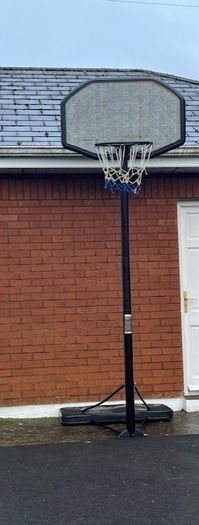 Portable Basketball Stand- Adjustable. stored in garage when not in use. In Very Good Condition.