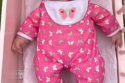 Baby doll with pink onesie EUC
