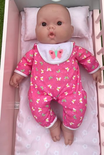 Baby doll with pink onesie EUC