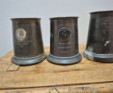 vintage pewter tankards, trophies for sporting events in the mid-20th century