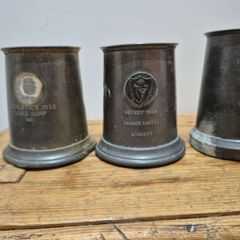 vintage pewter tankards, trophies for sporting events in the mid-20th century