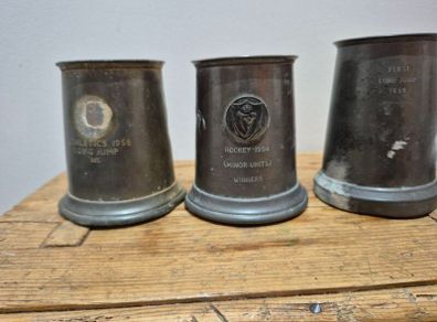 vintage pewter tankards, trophies for sporting events in the mid-20th century