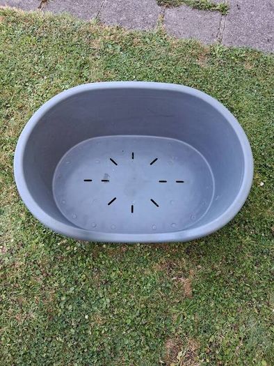 Small plastic dog bed.