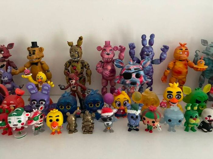 Five Nights at Freddys plushies and dragon figures