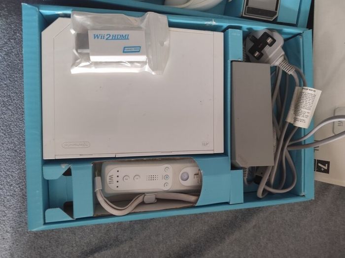 Wii with box, two controllers, sports and HDMI adapter