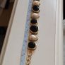 A beautiful gold-tone bracelet. Image 5