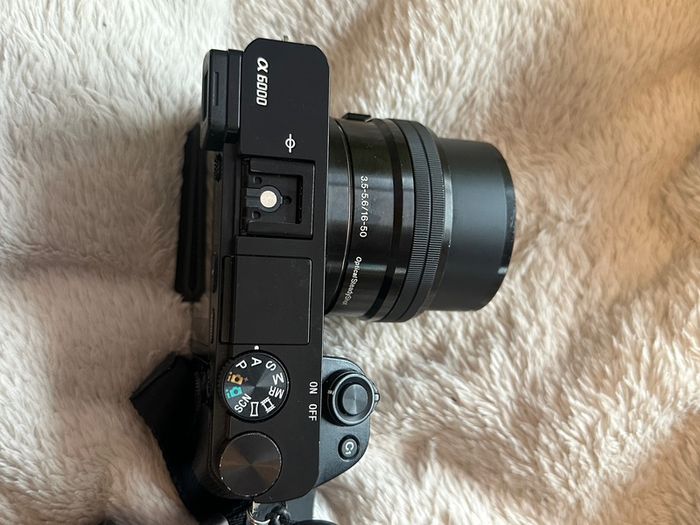 Sony A6000 + sigma 18-35mm F1.8 with Sony FE converter( original fitting on Nikon) small rig case included +batteries