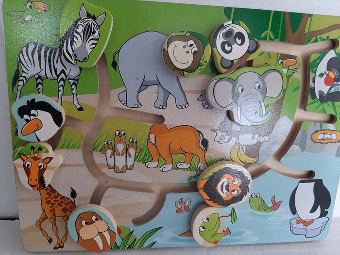 wooden jigsaw animals slide on board