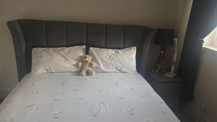 Reduced kingsize bed frame with matching curtains and leather armchair