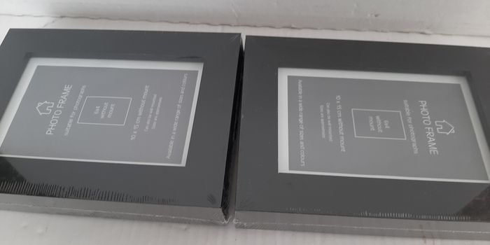 2 new wooden photo frames in wrapping