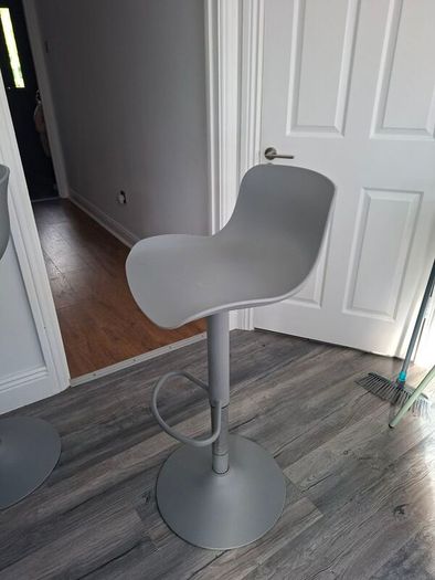 Two adjustable grey breakfast bar stools