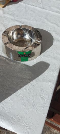 Heineken metal ashtray ,used condition, still nice condition ,buyer collects or pays postage thank you, sold as is,