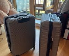 Two 23kg Grey Suitcases