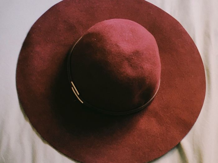 Deep burgundy wide-brim felt hat with subtle metallic detail, 100% wool