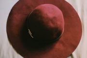Deep burgundy wide-brim felt hat with subtle metallic detail, 100% wool