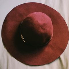 Deep burgundy wide-brim felt hat with subtle metallic detail, 100% wool