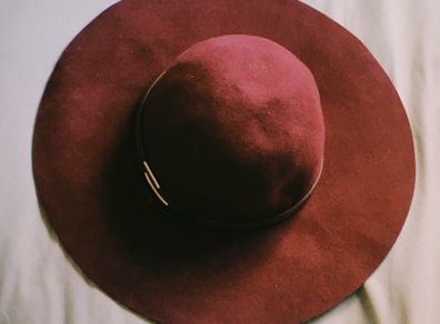 Deep burgundy wide-brim felt hat with subtle metallic detail, 100% wool