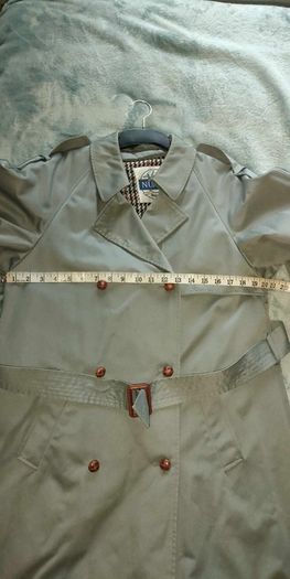 Vintage Nuage ladies trenchcoat Approximately late 90s early 00s Size 10 on label The colour is a pale bluey grey with brown buttons It's got an inner lining that can be removed