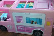 barbie dream house with a barbie camper van all together