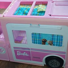 barbie dream house with a barbie camper van all together