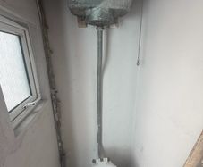 High toilet cistern and patio doors