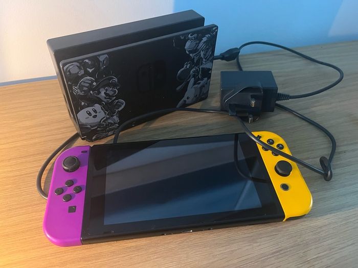 Nintendo Switch Console with Dock and Charger. Fully working, Purple and Orange joycons