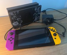 Nintendo Switch Console with Dock and Charger. Fully working, Purple and Orange joycons