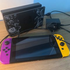 Nintendo Switch Console with Dock and Charger. Fully working, Purple and Orange joycons