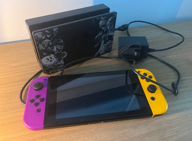 Nintendo Switch Console with Dock and Charger. Fully working, Purple and Orange joycons