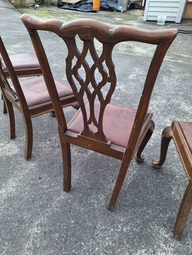 A set of four pierced Chippendale style chairs