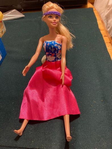 Two Barbie Dolls.