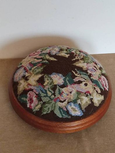 Vintage hand embroidered floral design on wooden base stool,