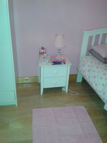 Single white wooden bed & bedside locker