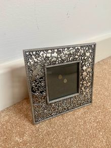 Small metal picture frame with flower detail