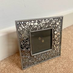 Small metal picture frame with flower detail