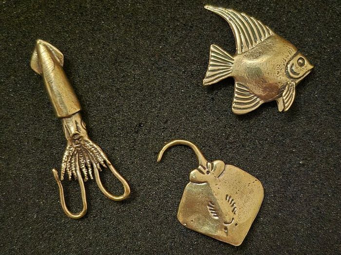 3 brass fish.