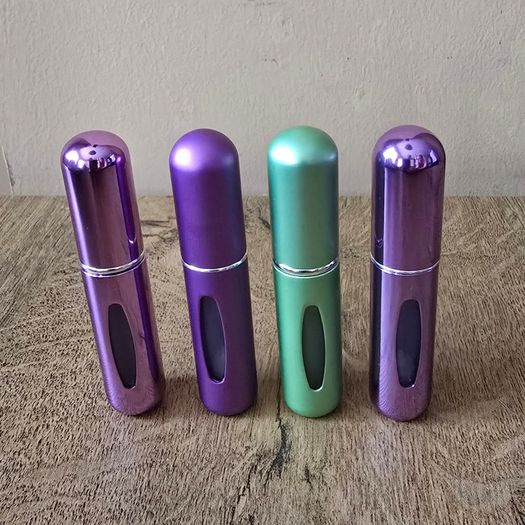 4 mini perfume spray bottles