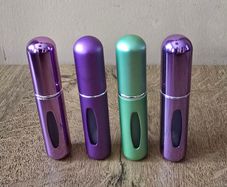 4 mini perfume spray bottles