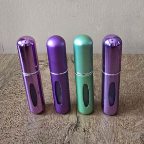4 mini perfume spray bottles