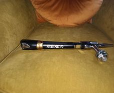 Guinness tap with stainless steel creamer nozzle.
