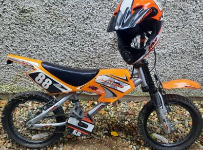 Orange pedal bike with helmet
