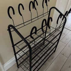 Black metal shoe rack